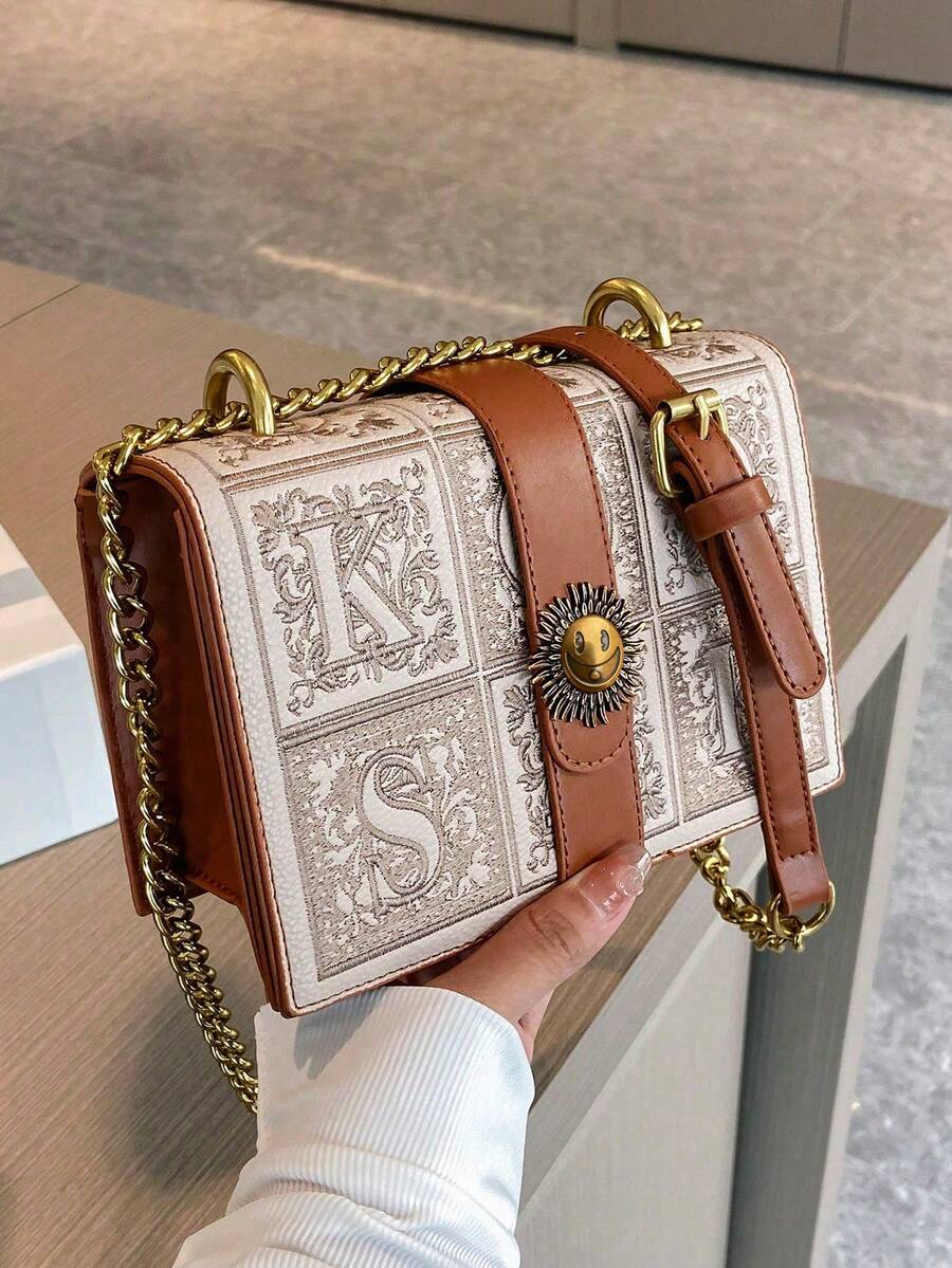 Back view of tan structured crossbody bag with smooth leather-look finish