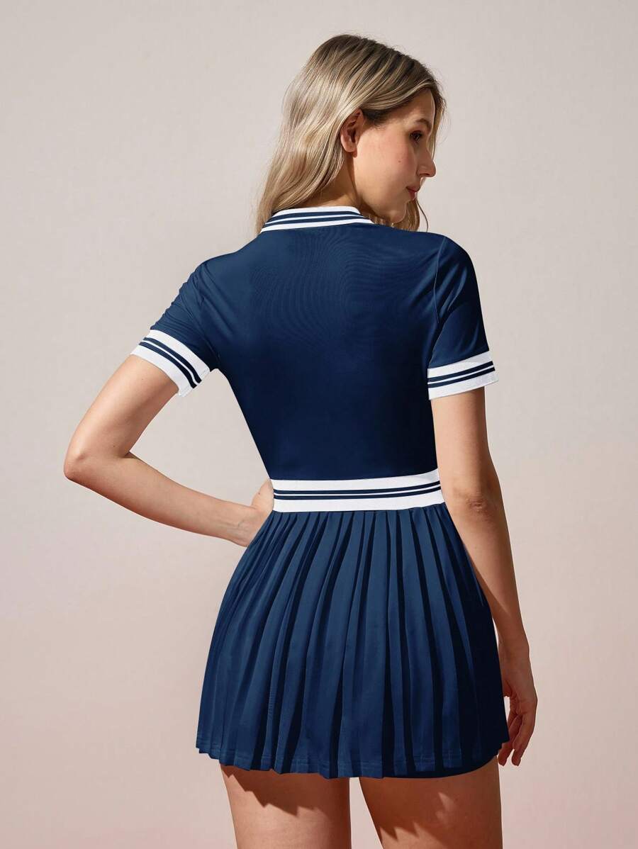navy and white stripe polo tennis mini dress with pleated skirt built in shorts and pockets image 2
