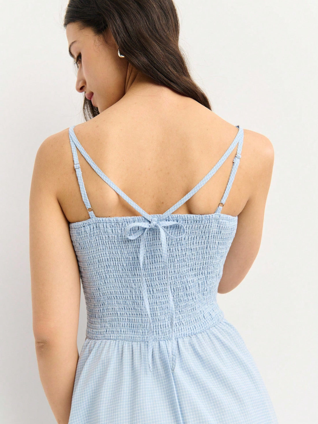 Twirl into summer style with this delightful blue gingham midi dress! The smocked bodice hugs you in all the right ways while the flared skirt swishes with every step, perfect for picnics, garden parties, and sunny day adventures. Classic gingham print brings that cheerful, timeless charm that never goes out of style. Whether you're dancing at a festival or sipping lemonade on the porch, this dress is your go-to for effortless, feel-good fashion that celebrates the season.