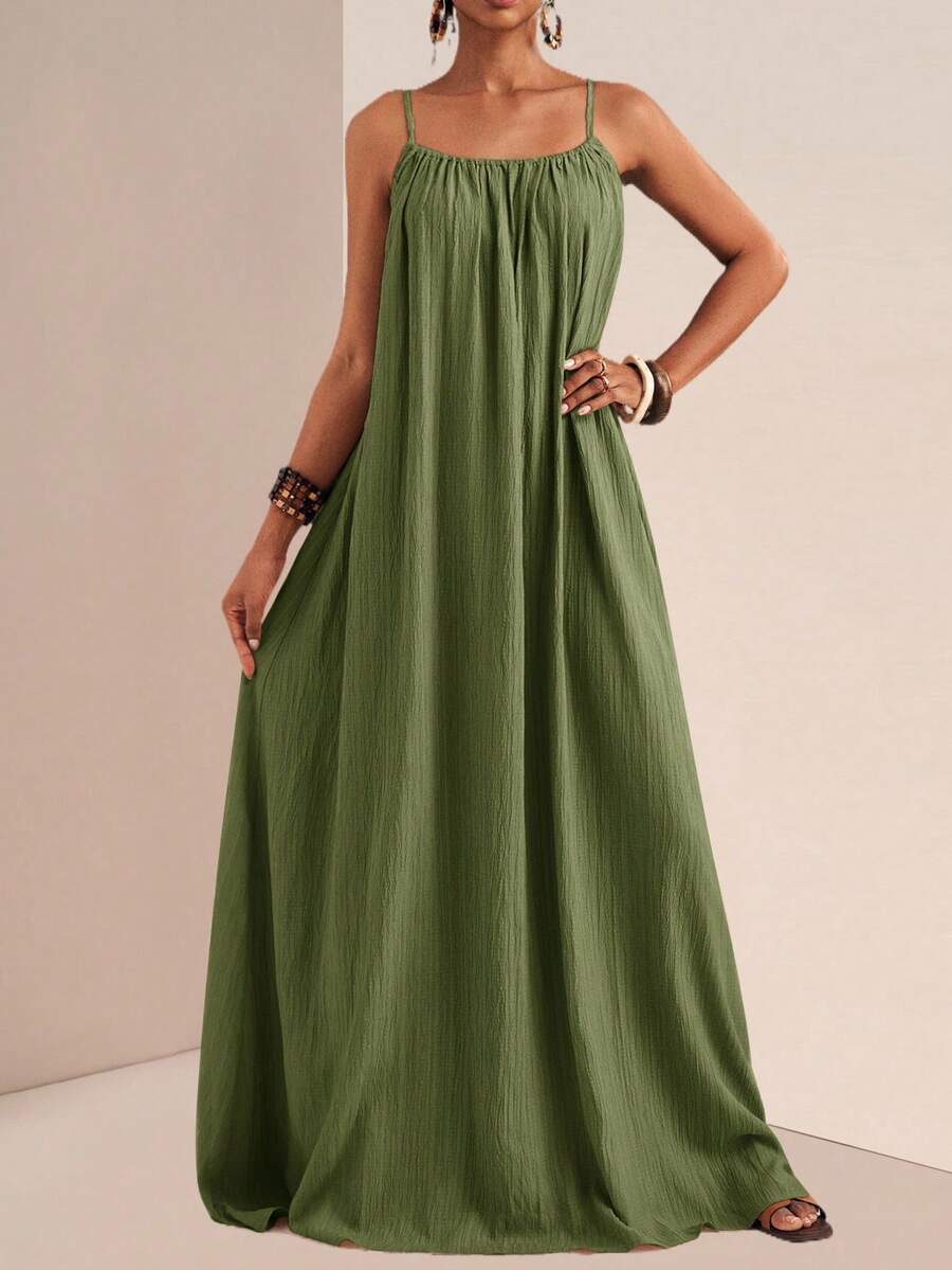 This chic plus size brown maxi dress features a pleated design and casual cami straps, offering a blend of style and comfort. Its flowing silhouette softly enhances curves while ensuring ease of movement, making it ideal for effortless everyday wear. Perfect for enhancing your wardrobe with a versatile piece that transitions seamlessly from casual outings to relaxed gatherings.