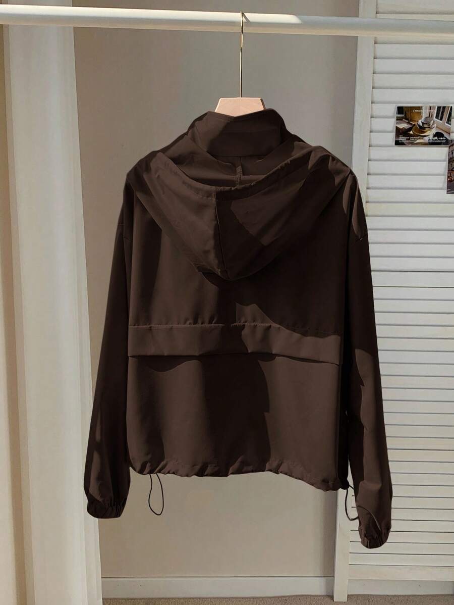 Wrap yourself in warmth and style with this cozy coffee brown cropped jacket. Designed for fall and winter layering, this zip-up hoodie combines comfort with practical sun protection. The cropped silhouette flatters your frame while the soft fabric keeps you snug during cooler months. Perfect for casual outings, weekend adventures, or relaxed days at home. Layer it over your favorite tee or wear it solo for effortless, on-trend appeal.