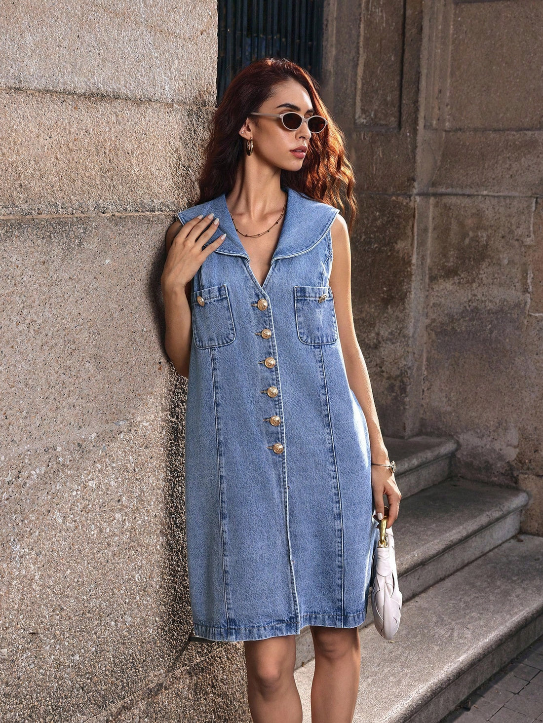 Ahoy, style lover! This charming sleeveless denim dress brings nautical vibes to your wardrobe with its crisp sailor collar and adorable buttoned pocket details. The classic denim fabric offers durability and timeless appeal, while the sleeveless cut keeps things breezy and versatile. Whether you're heading to a holiday gathering or just want to channel coastal charm, this dress pairs effortlessly with sneakers, sandals, or boots. It's the perfect blend of playful maritime flair and everyday wearability—you