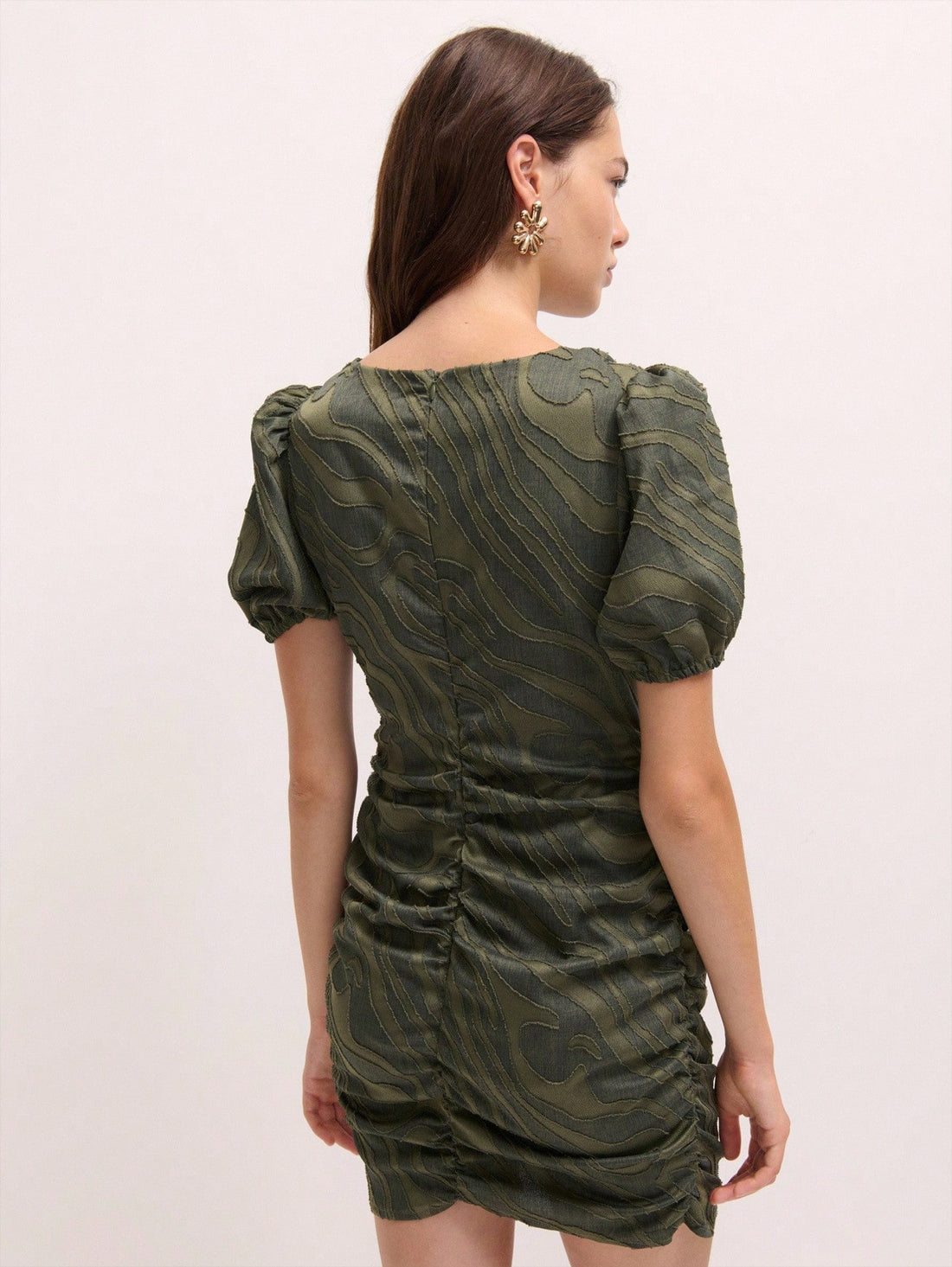 Turn heads at your next event in this eye-catching mini dress that's all about making a bold impression. The textured swirl pattern adds visual intrigue and dimension, while voluminous puff sleeves bring a playful, fashion-forward edge. Perfect for parties, celebrations, and moments when you want to stand out from the crowd. This dress combines statement-making style with comfortable, flattering silhouettes that let you move and celebrate with confidence. Whether you're dancing the night away or mingling at
