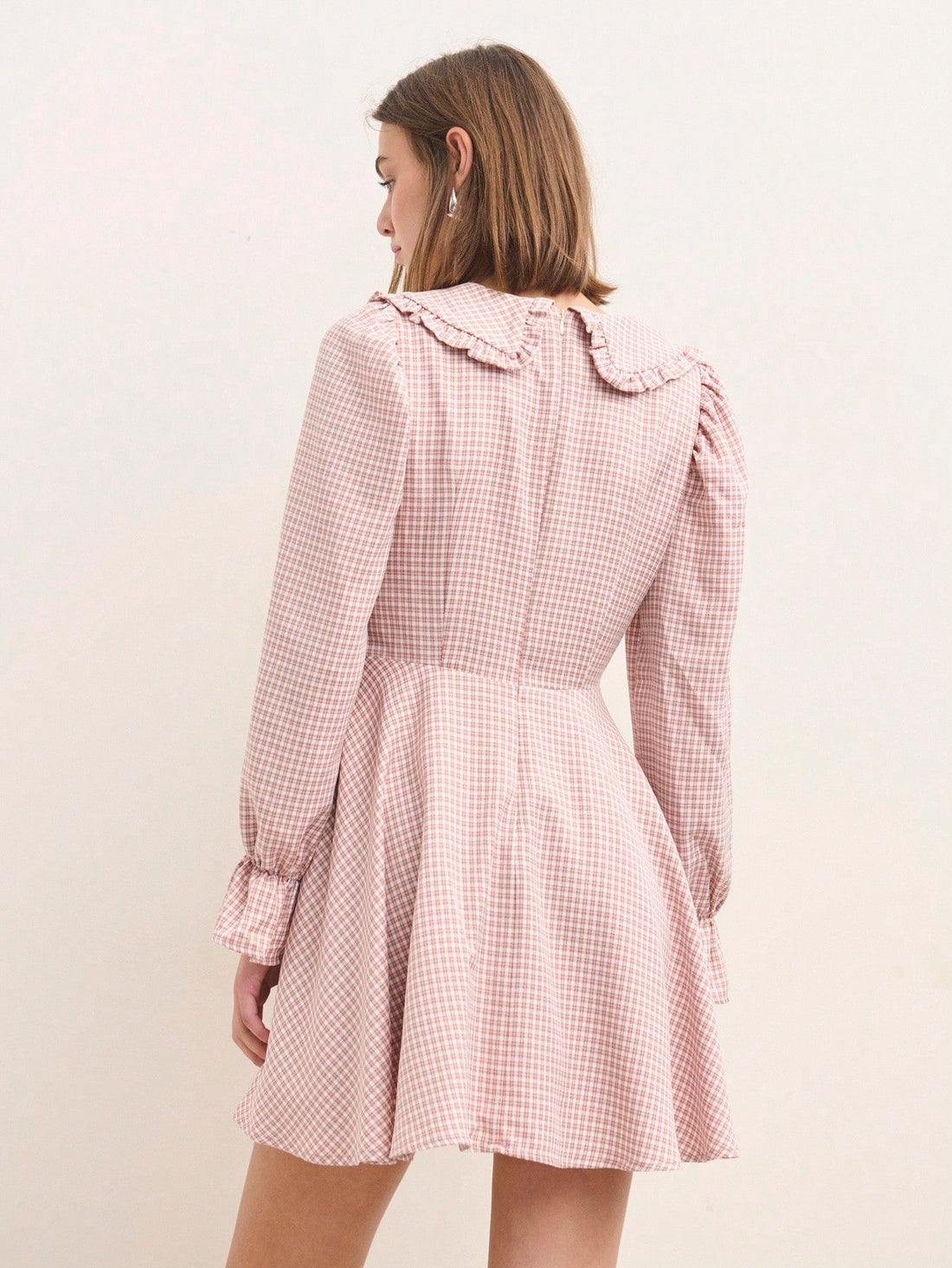 Elevate your wardrobe with this charming pink long sleeve dress that's as versatile as it is adorable! The ruffled hem adds a playful touch of texture, while the tie front creates a flattering silhouette that works for any occasion. Whether you're heading back to school, embracing fall fashion, or looking for a polished teacher outfit that doesn't sacrifice style, this dress delivers effortless elegance. Soft, comfortable, and undeniably chic—it's the piece you'll reach for again and again.