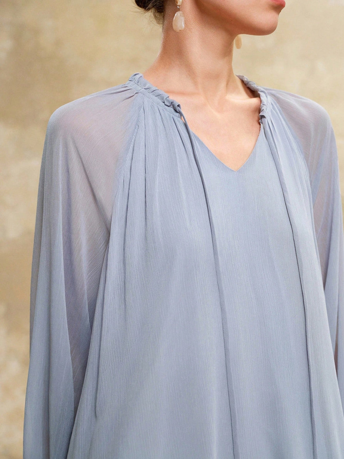 Embrace breezy elegance with this Flowy V-Neck Lantern Sleeve Maxi Dress. Crafted from lightweight chiffon, it dances with every step, perfect for sunny vacations or turning heads at classy gatherings. The playful lantern sleeves add a whimsical touch, making comfort and style your new summer essentials.