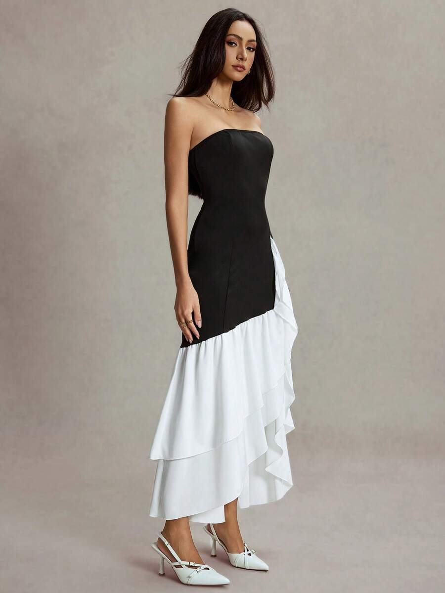 Make a statement in this stunning halter color block fishtail maxi dress that's equal parts glamorous and fun. The structured corset bodice cinches your waist beautifully while the contrasting color blocks add modern flair. That dramatic fishtail hem? Pure showstopper energy. Whether you're heading to a formal gala, wedding, or special celebration, this dress delivers elegance with a playful twist. The halter neckline flatters while keeping things sophisticated, and the flowing maxi silhouette ensures you'l