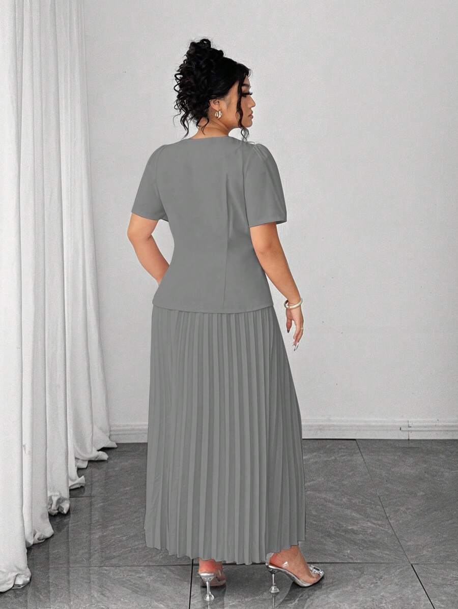 Embrace effortless elegance with this charming two-piece pleated skirt set that captures the essence of French romance. The delicate pleating creates graceful movement with every step, while the coordinated pieces work together to deliver a polished, put-together look. Perfect for summer gatherings, casual outings, or those moments when you want to feel undeniably chic without trying too hard. This set proves that timeless style never goes out of fashion—just slip it on and let the compliments flow.