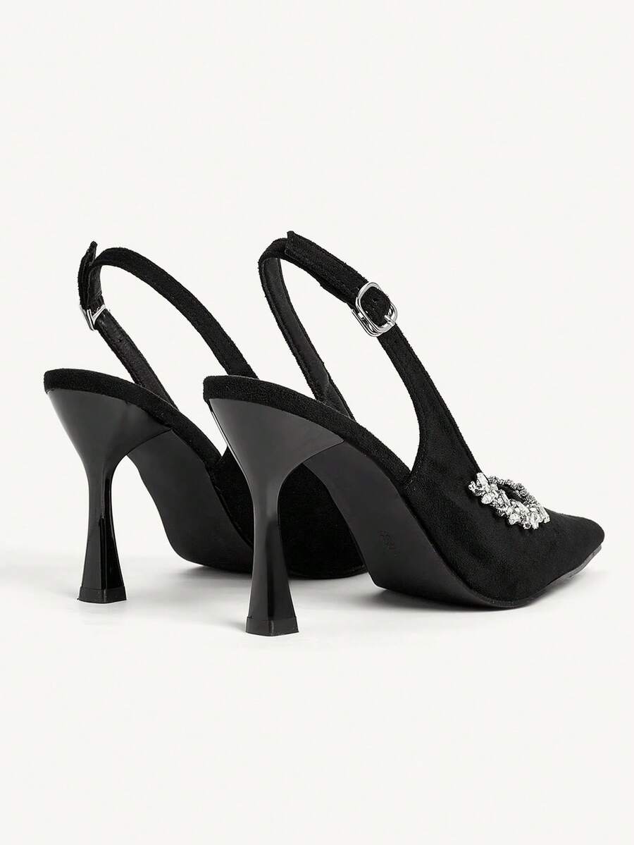 Step into sophistication with these stunning black suede stiletto heels, adorned with shimmering rhinestones for an eye-catching finish. Featuring a sleek slingback design and pyramid heel, these elegant satin heels are crafted for those special moments—whether it's a formal gala, evening celebration, or festive occasion. The high heel silhouette elongates your legs while the luxurious materials ensure comfort and style. Perfect for making a memorable entrance at any upscale event.