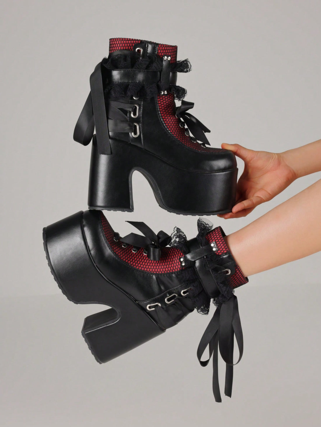 Step up your style game with these Chunky Platform Ankle Boots—where goth meets punk with a playful twist! Featuring bold lace-up fronts and a handy side zipper for easy on and off, these boots add height and attitude to any outfit. Perfect for turning heads and dancing the night away, they bring edgy flair and comfort together in one fierce package.