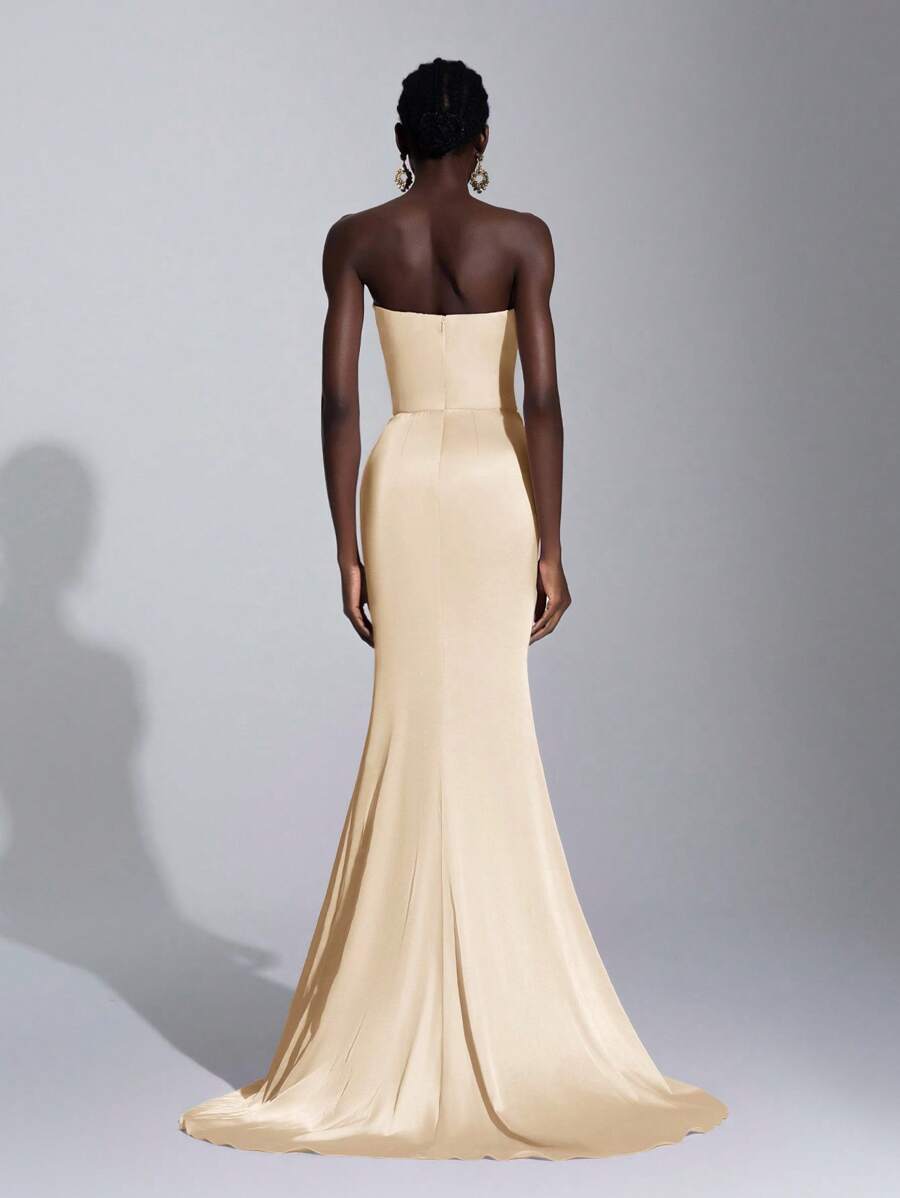 Make a statement in this stunning pink mermaid gown that's pure elegance with a playful twist. The asymmetrical strapless neckline creates an effortlessly chic silhouette, while the ruched waistline adds dimension and flatters your figure beautifully. Perfect for proms, galas, weddings, or any occasion where you want to turn heads and feel absolutely fabulous. This show-stopping dress combines sophisticated design with just enough drama to make you the star of the evening.