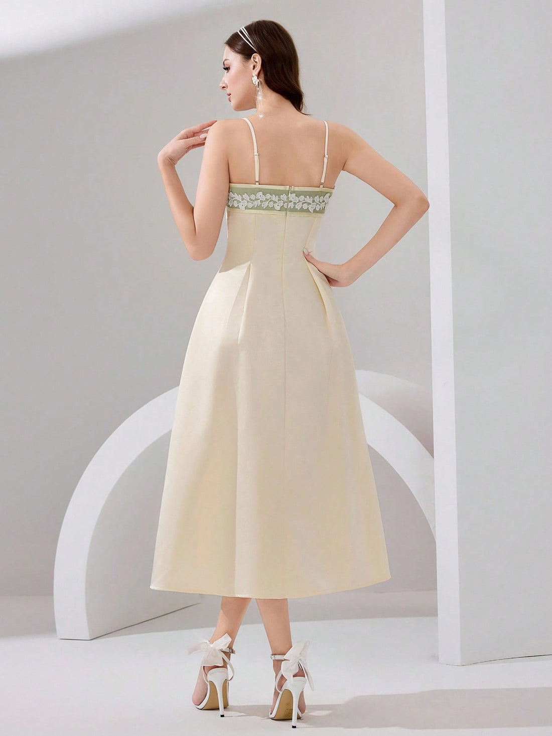 Make a statement in this show-stopping evening gown that's equal parts glamorous and fun! Featuring delicate 3D floral embellishments that catch the light beautifully, this dress combines elegance with playful flair. The flattering V-neckline and spaghetti straps create a sophisticated silhouette, while the high slit adds a daring touch of drama. A sweeping train follows your every move, ensuring you'll turn heads at any formal event. Perfect for galas, weddings, or those moments when you want to feel absol