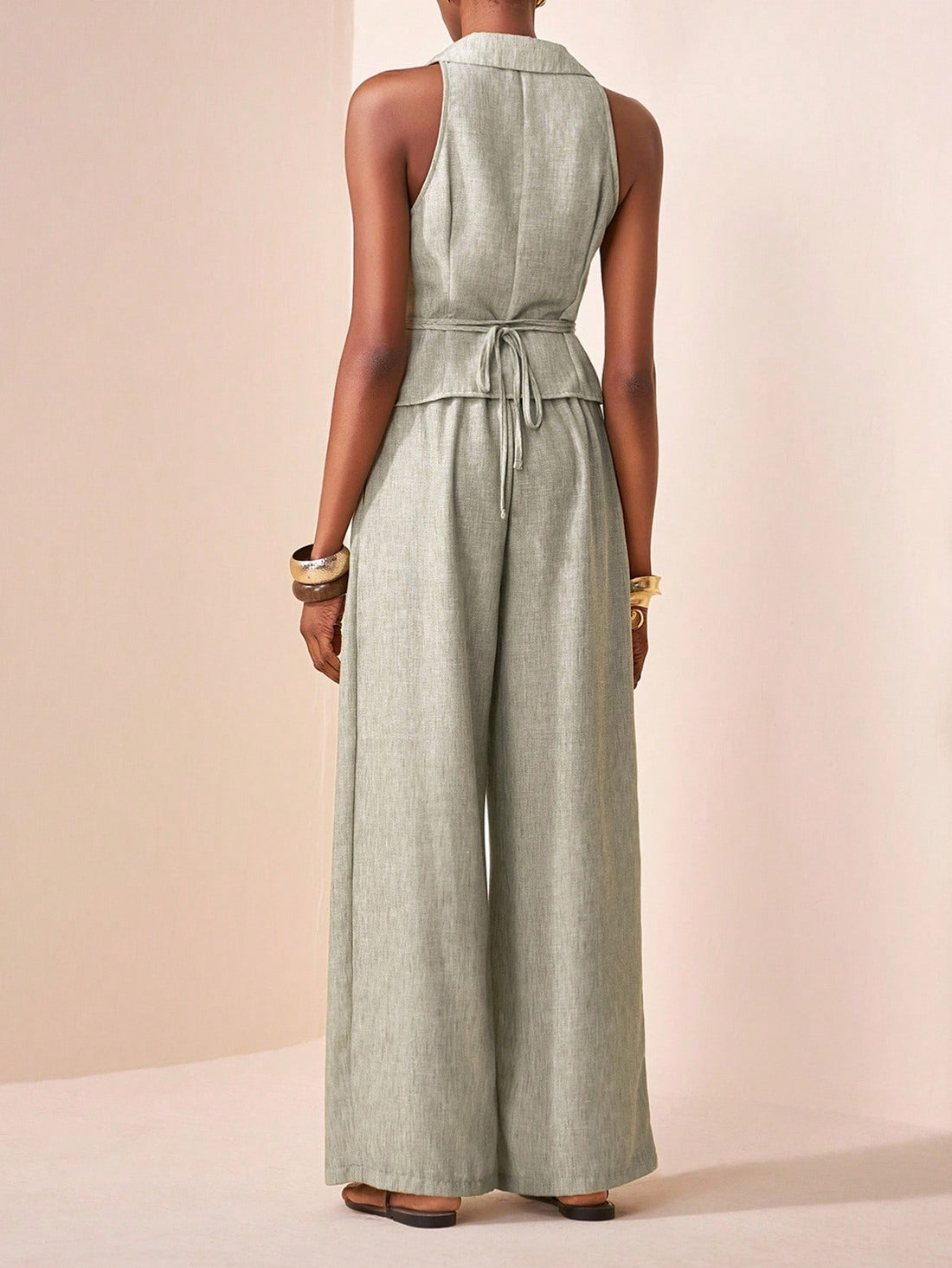 Elevate your wardrobe with this fabulous two-piece set that's ready for anything! The sleek sleeveless vest pairs perfectly with tailored straight-leg pants in a gorgeous green shade that flatters every skin tone. Whether you're dancing at summer festivals, celebrating at weddings, or keeping it chic for everyday adventures, this versatile combo delivers effortless style. Mix and match with your favorite pieces or wear them together for an instantly polished look. It's the outfit that works as hard as you d