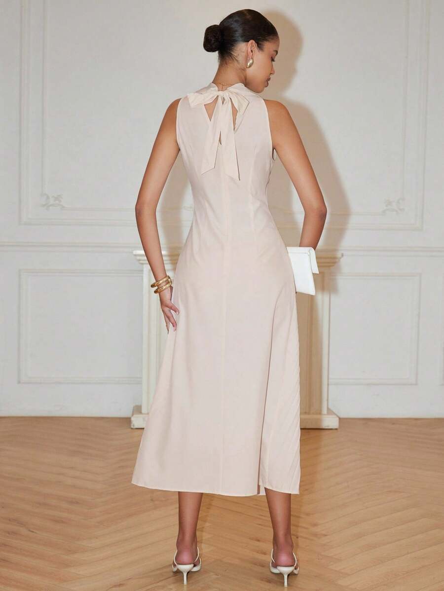 Step into the spotlight with this playful maxi dress featuring a deep V-neck and fluttery pleats that dance as you move. The high slit adds a cheeky twist, while the bow detail brings a flirty touch to this chic A-line silhouette. Perfect for sunny spring days and breezy summer evenings, it’s the ultimate party-ready piece that keeps things fun and effortlessly stylish.