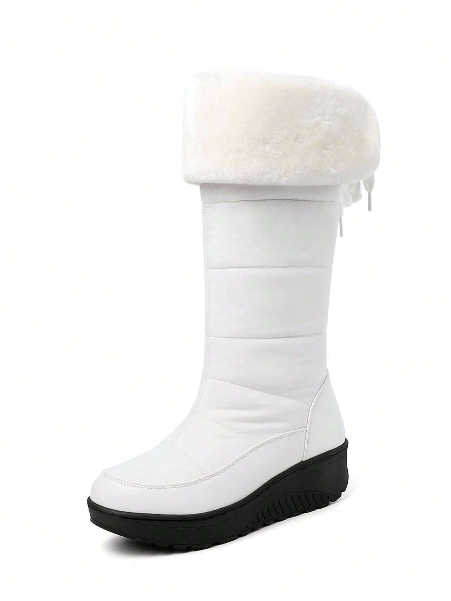 Step out in style and warmth with these playful knee-high snow boots! Featuring cozy fuzzy faux fur and waterproof platform wedge heels, they keep your feet dry and comfy all winter long. Perfect for snowy adventures or adding a chic touch to your cold-weather outfits.