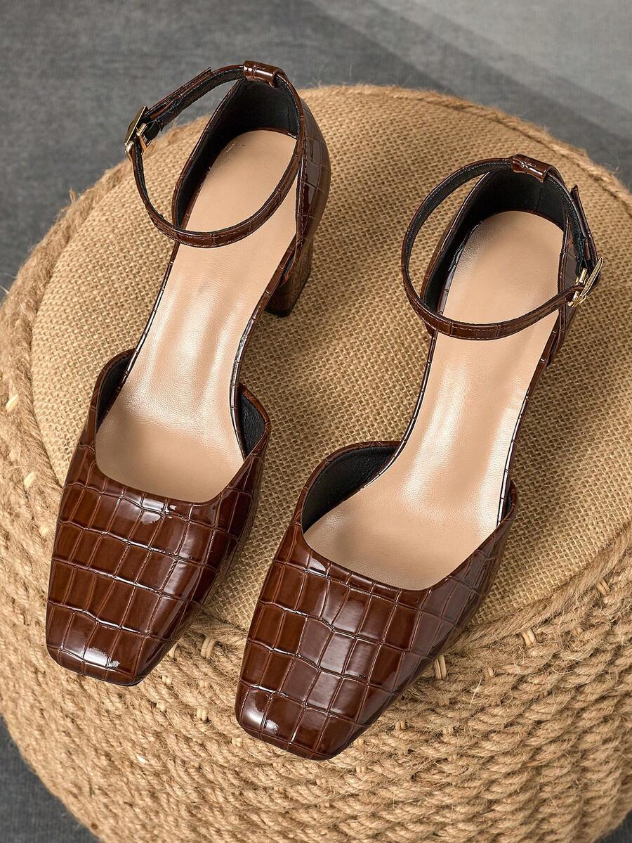 Step into sophistication with these stunning square-toe pumps that effortlessly transition from boardroom to evening out. The sleek buckle closure adds a touch of polish while the 7cm chunky heel provides all-day comfort without sacrificing style. Perfect for anyone who refuses to choose between looking fabulous and feeling great, these versatile heels are your go-to for making a memorable impression at work or special events.