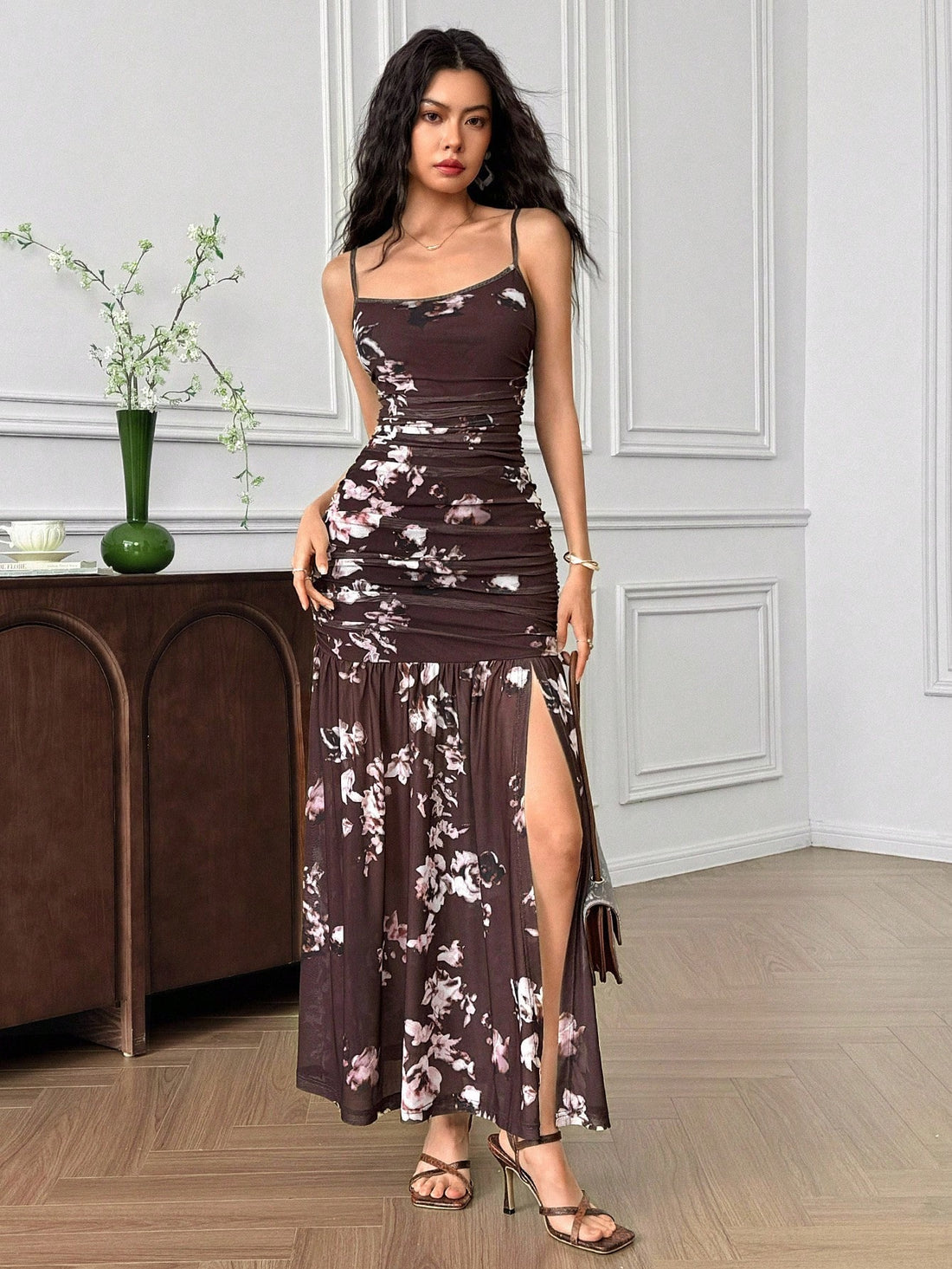 Turn heads this summer with our Elegant Women's Floral Print Dress. Light spaghetti straps and a high slit keep you cool and playful while the vibrant floral pattern adds a splash of joyful charm. Perfect for sunny outings, it combines comfortable elegance with a fun, flirty vibe that’s ready for any adventure. Step out in style and let your dress do the talking!