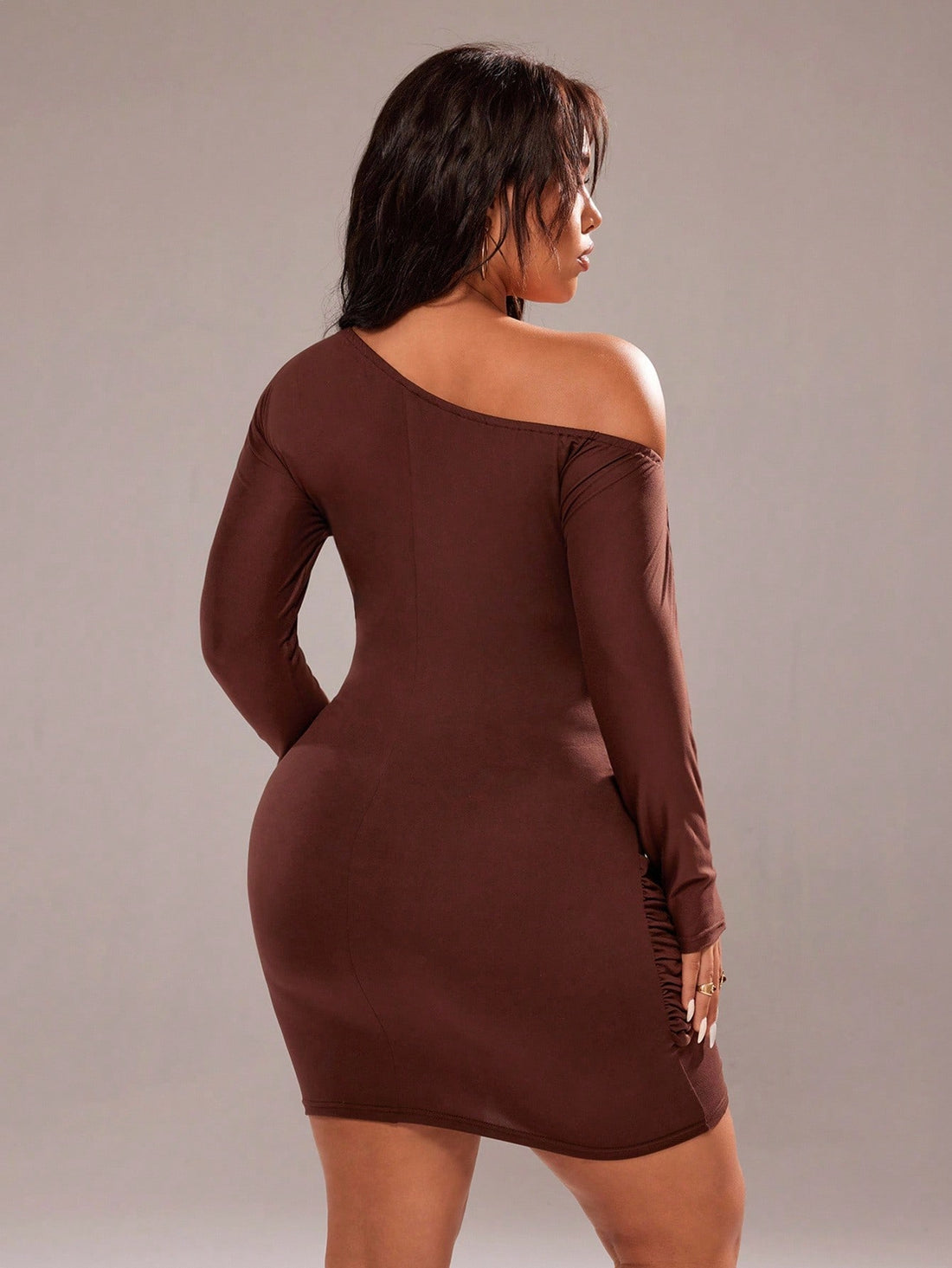 Turn heads this fall in a dress that's equal parts sass and sophistication. This bodycon mini features an eye-catching asymmetric shoulder design paired with flattering ruching that hugs you in all the right ways. Crafted from smooth polyester, it's the perfect pick for parties, date nights, or whenever you want to feel absolutely fabulous. Available in plus sizes and a range of solid colors, this elegant piece proves that sexy never goes out of style. Slip it on and own the room.