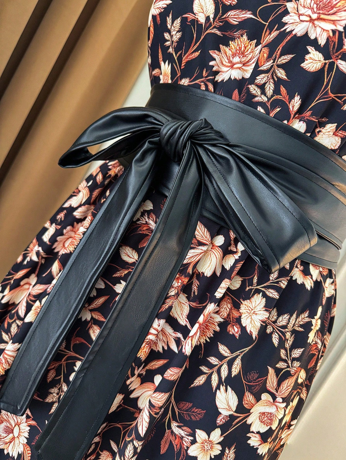 Step out in style with this playful plus size floral dress, featuring flared sleeves that add a fun twist and a belted waist to highlight your curves. Perfect for casual vacations, its vibrant print and comfortable fit make every moment feel like a celebration.