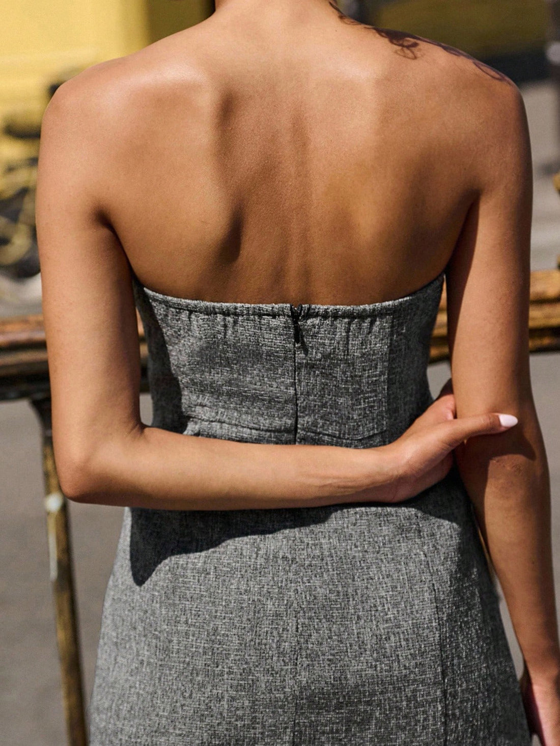 Elevate your autumn wardrobe with this charming grey tweed strapless mini dress! The sophisticated tweed fabric pairs beautifully with delicate black lace trim, creating a look that's both polished and playful. Perfect for back-to-school events, casual outings, or whenever you want to turn heads, this dress strikes the ideal balance between trendy and timeless. The strapless silhouette offers a modern touch, while the mini length keeps things fun and flirty. Whether you're heading to a weekend brunch or a s