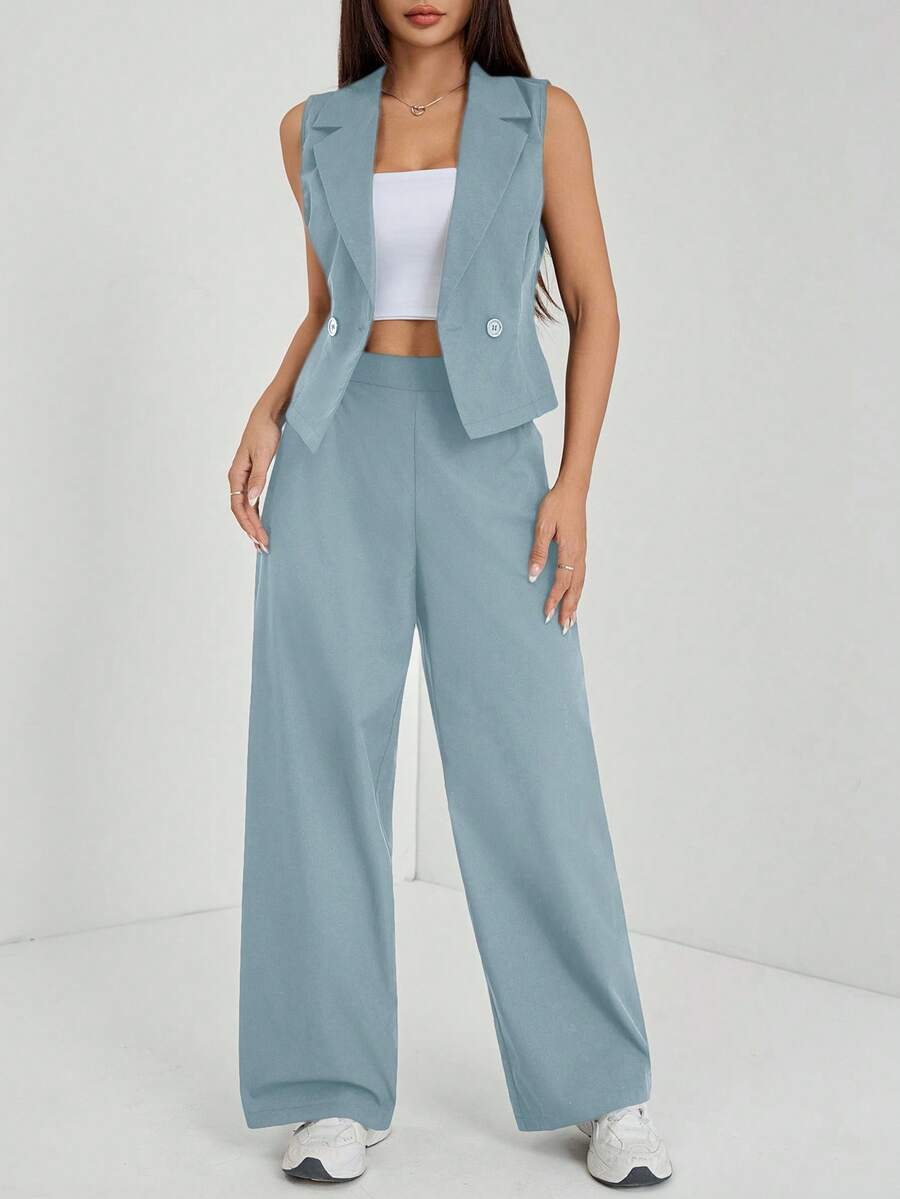 Elevate your fall wardrobe with this sophisticated navy blue two-piece set, expertly tailored for petite frames. The sleeveless top features a refined silhouette that pairs seamlessly with matching tailored pants, creating a polished look perfect for work, weekend outings, or casual gatherings. The timeless navy hue offers versatility—dress it up with heels and jewelry or keep it relaxed with sneakers and a cardigan. Quality construction ensures durability and comfort throughout the season.