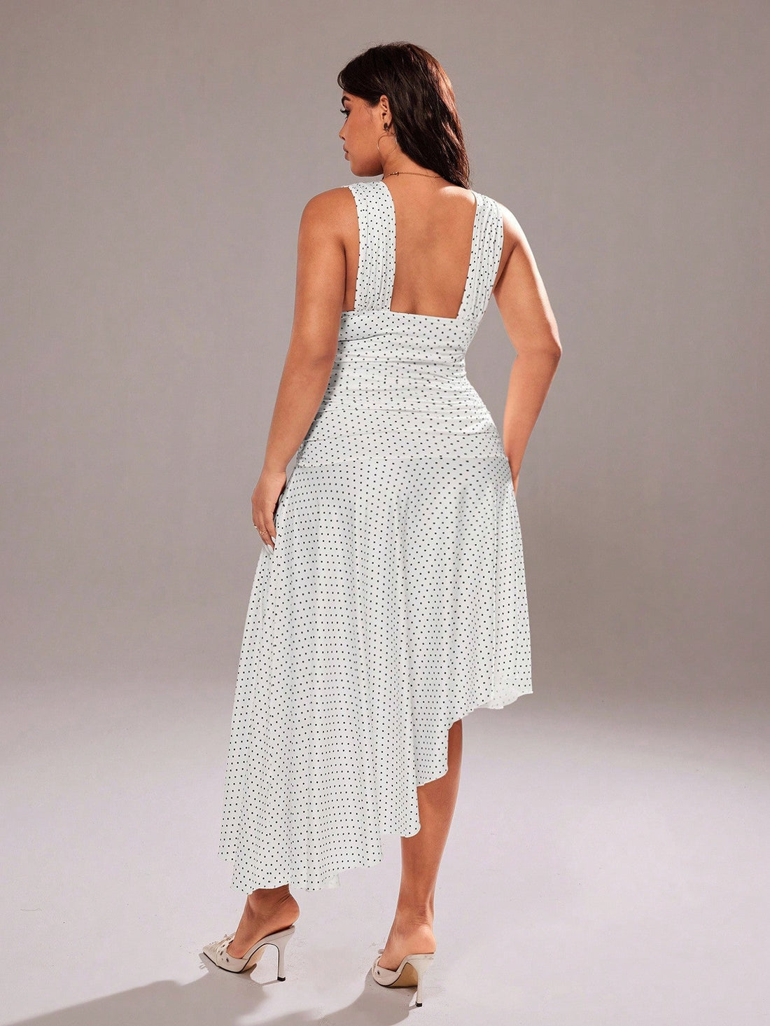 Turn heads wherever you go in this fabulous plus-size maxi dress! The deep V-neckline adds instant glamour while the classic black and white polka dot pattern keeps things fun and flirty. Perfect for romantic evenings out or packing for your next adventure, this dress transitions effortlessly from day to night. The flowing maxi silhouette flatters your curves and moves beautifully with every step. Whether you're exploring a new city or enjoying an unforgettable date, this versatile piece is your new go-to f