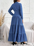 Back view of long sleeve denim shirt dress with fitted waist and tiered ruffle hem