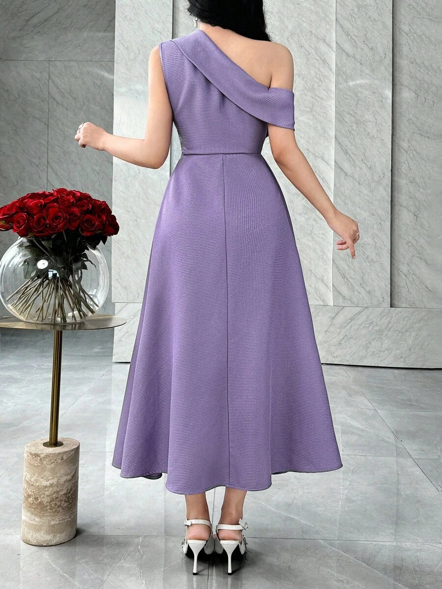 Close front detail of lavender purple one-shoulder midi dress with layered ruched waist in marble interior