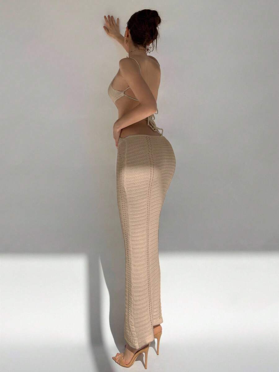 Slip into effortless style with this chic knitted camisole dress that's giving all the right vibes. The flattering U-neckline and strategic hollow-out details add a flirty edge, while the slim-fit silhouette hugs your curves just right. Crafted from soft, breathable knit fabric, it's perfect for casual outings, weekend brunches, or layering over your favorite tee. Versatile enough to dress up or down, this piece is your new go-to for looking put-together without trying too hard.
