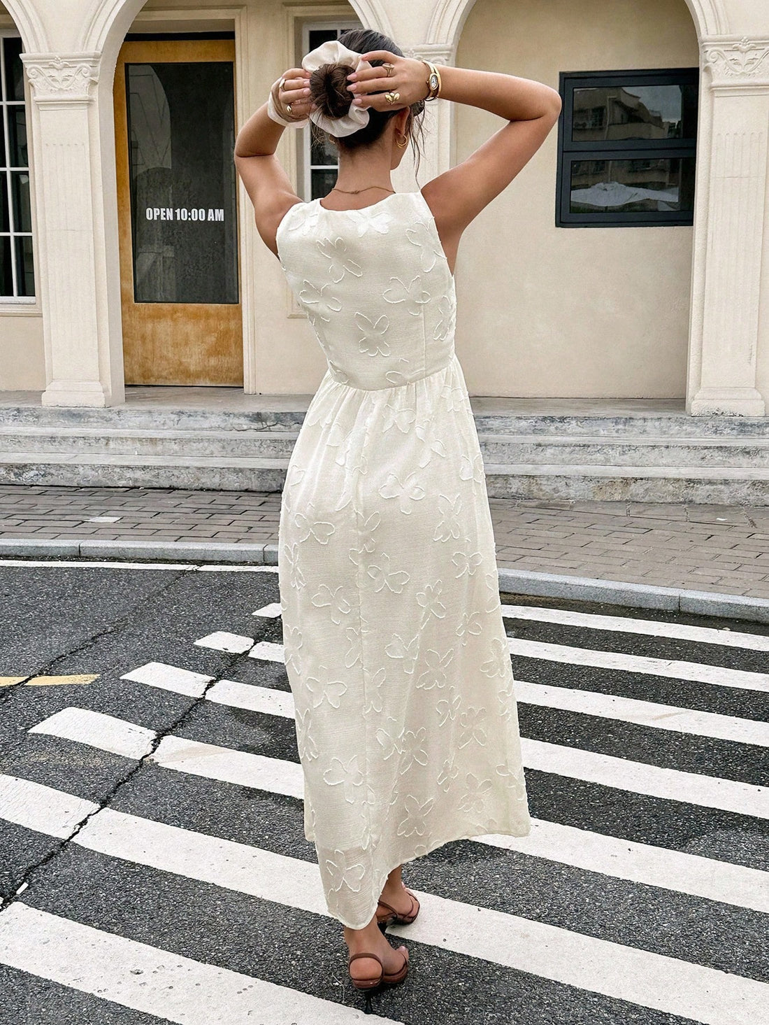 Step into effortless elegance with this chic floral jacquard dress. Featuring a deep V-neck and a flattering tie waist, its sleeveless design keeps things light and breezy. Perfect for turning heads with a playful touch of sophistication wherever you go.