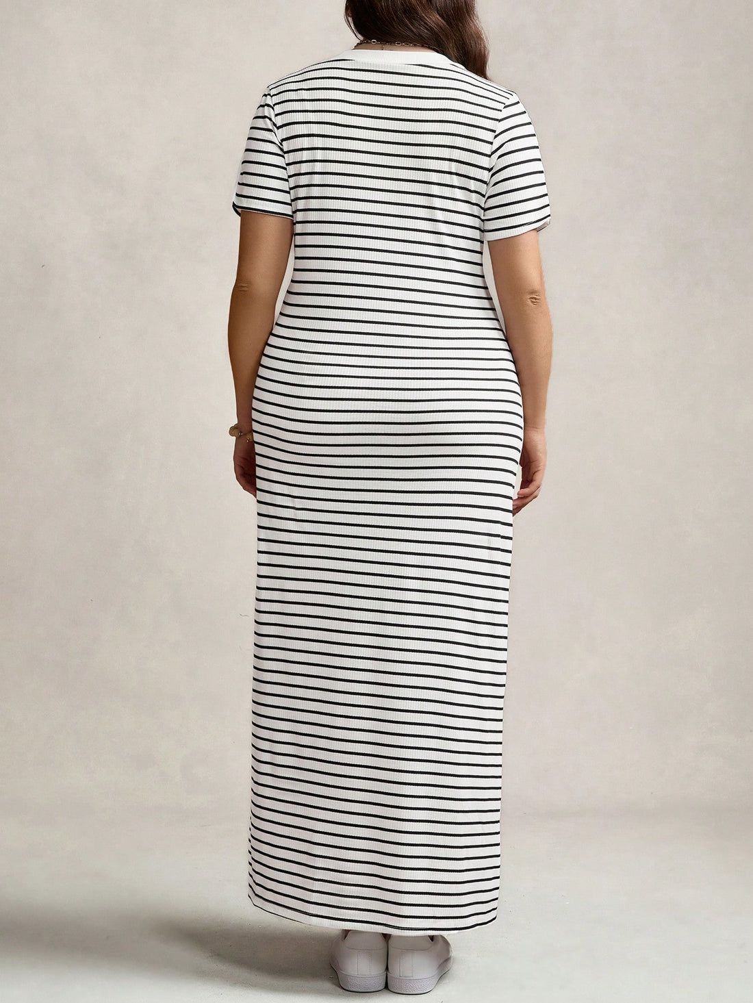 Step out in style and comfort with this playful plus size black and white striped maxi dress. Featuring a flattering V-neck and breezy short sleeves, it’s perfect for casual days or sporty adventures. The flowing design keeps you cool while the bold stripes add a fun, chic vibe to your everyday wear.