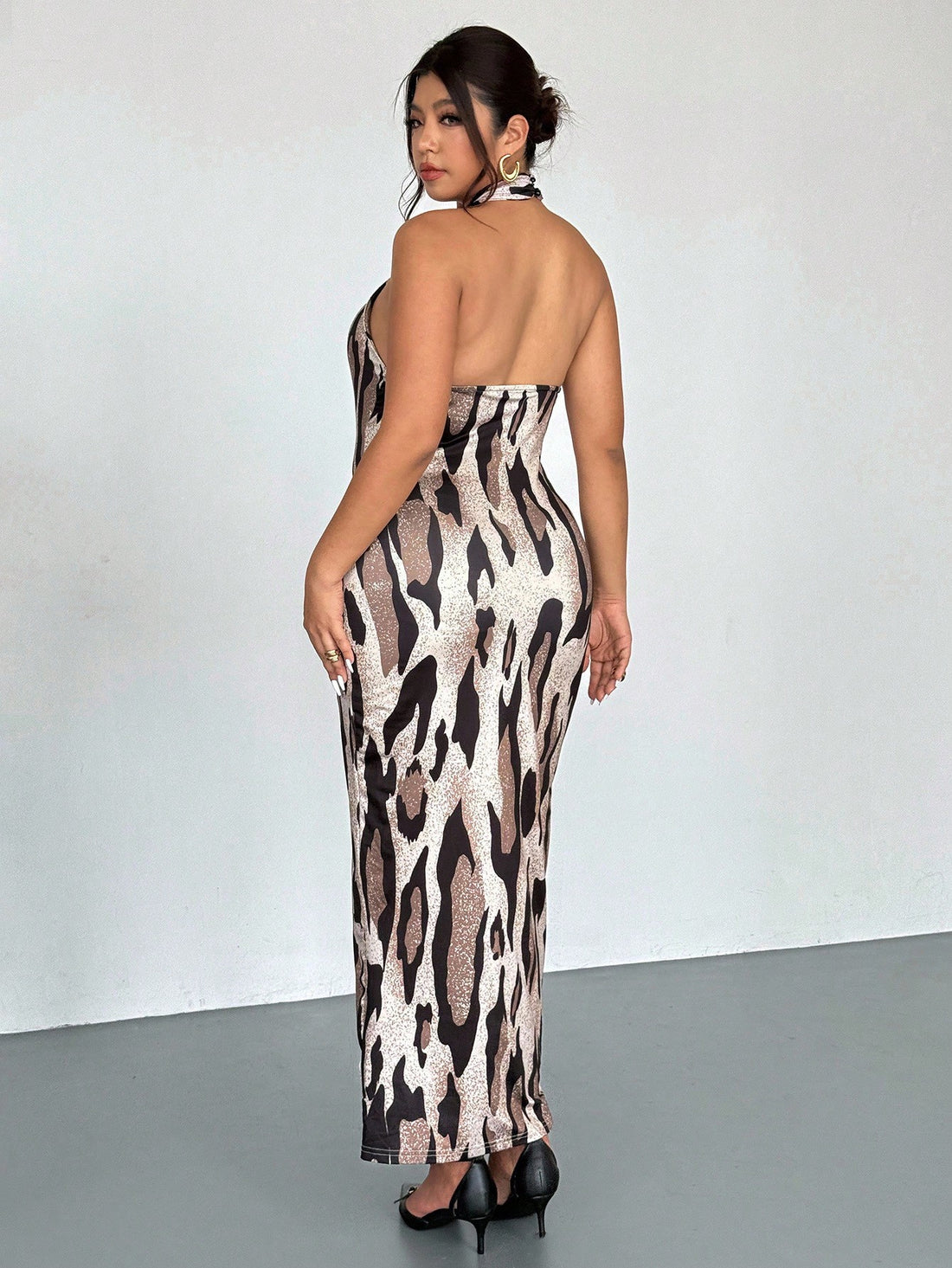 Turn heads this summer with our Plus Size Sexy Leopard Print Backless Halter Dress. Designed to celebrate curves, its daring backless cut and vibrant leopard pattern make it perfect for confident, fun-filled days or nights out. The halter style adds a flirty touch while keeping you cool and comfortable. Embrace boldness and let your wild side shine effortlessly in this standout dress.