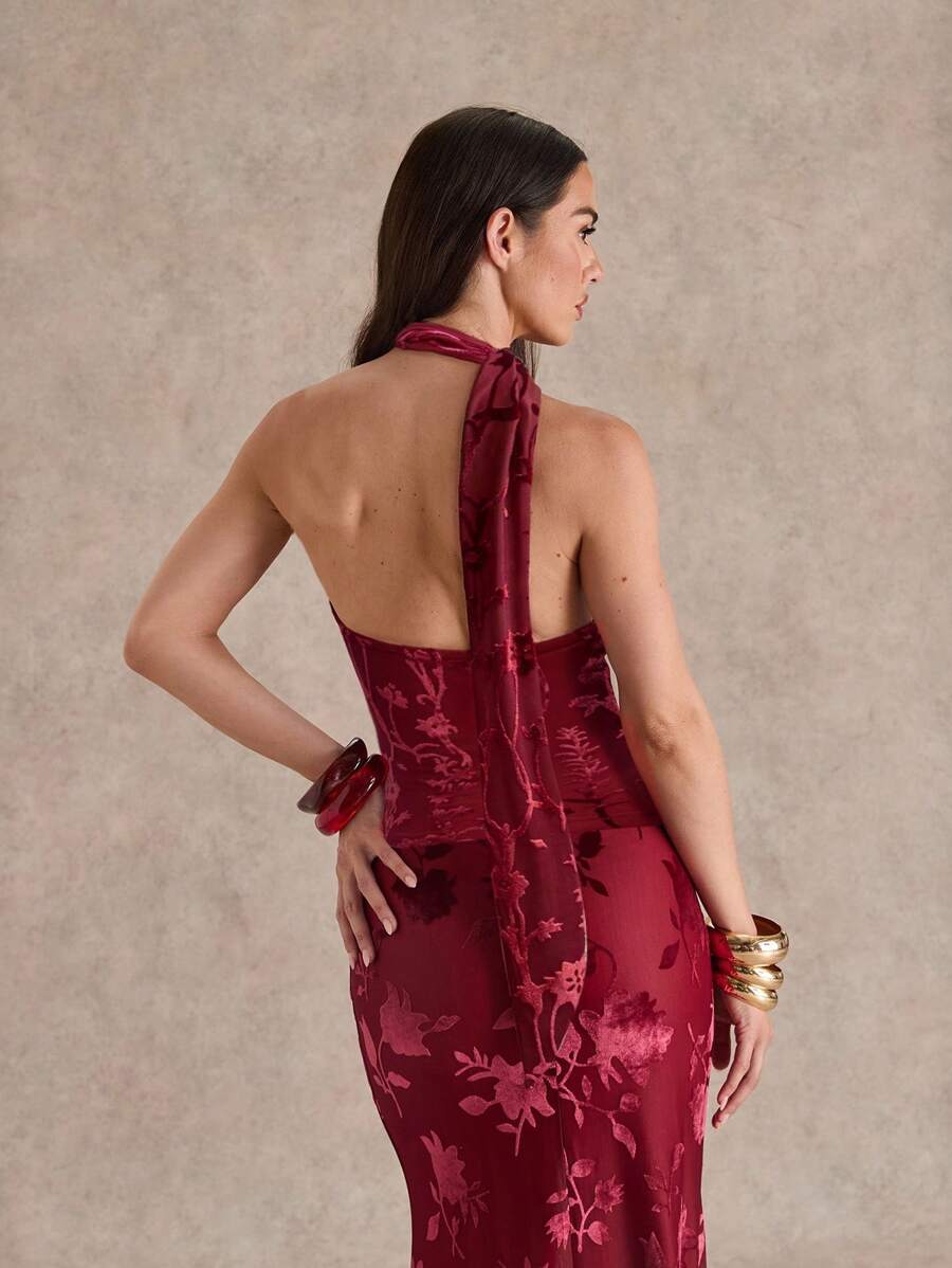 burgundy floral burnout halter maxi dress with deep V ruffle neckline, scarf tie halter, open back, sheer floral velvet texture, fitted waist and floor length mermaid hem image 3