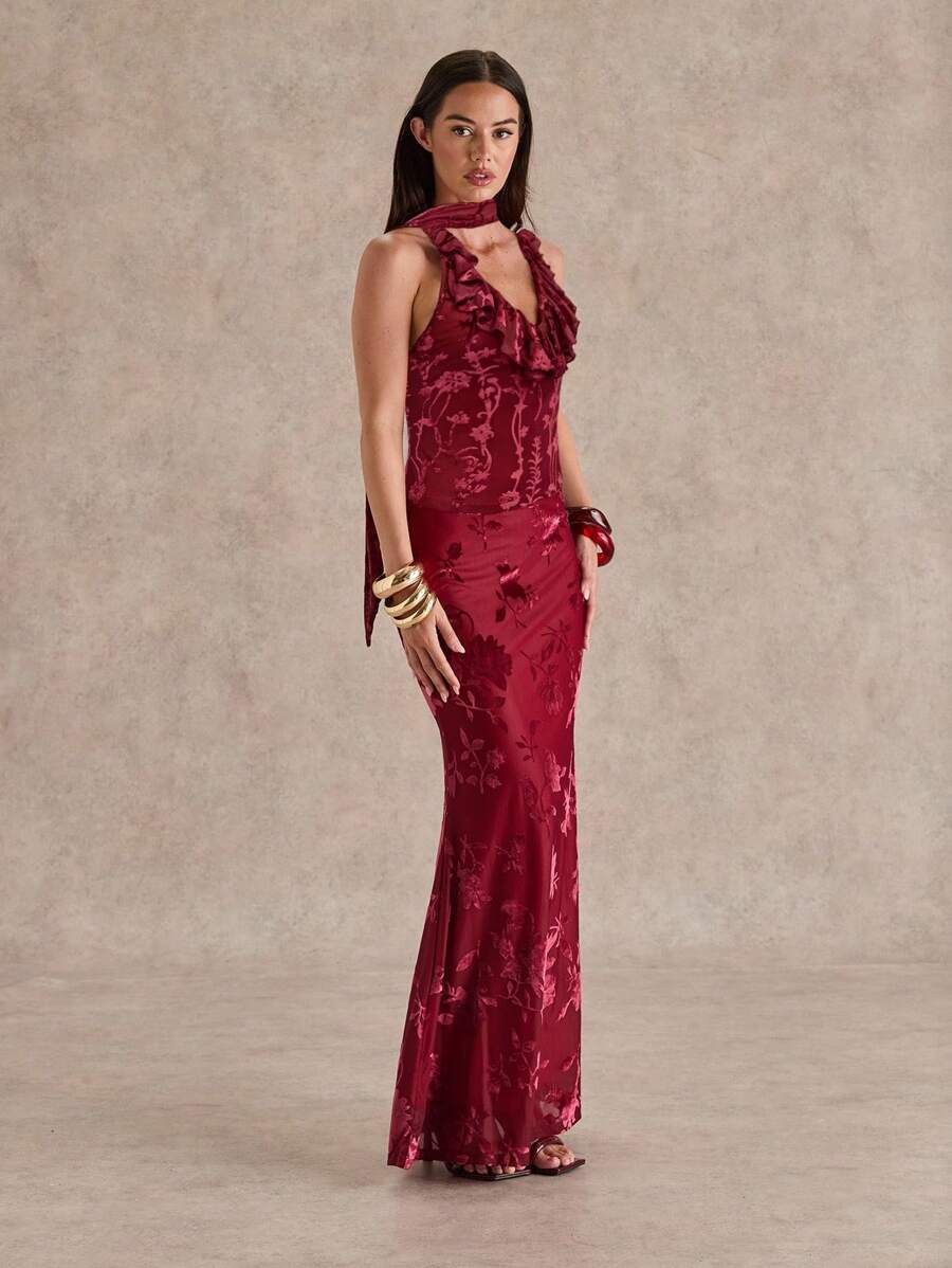 burgundy floral burnout halter maxi dress with deep V ruffle neckline, scarf tie halter, open back, sheer floral velvet texture, fitted waist and floor length mermaid hem image 4