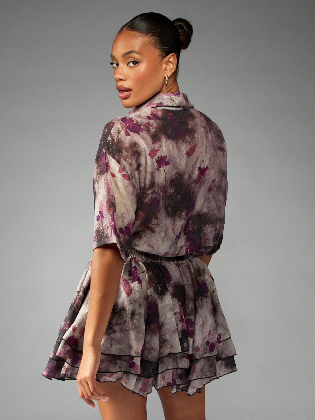 Turn heads in this two-piece set featuring a watercolor floral print. Perfect for summer parties and beach vacations, this set effortlessly combines style and comfort. Make a statement and enjoy the warm weather in this versatile and playful outfit.