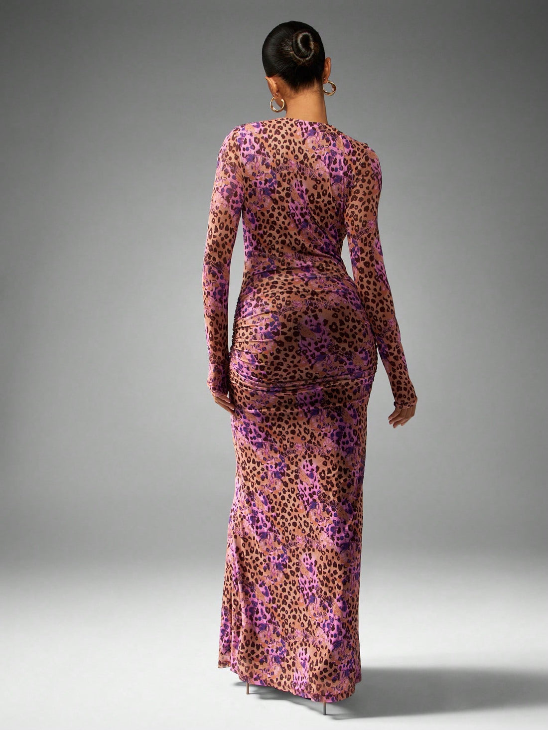 Turn heads at your next event in this stunning leopard print mesh evening gown. The daring plunge neckline and flowing long sleeves create an effortlessly chic silhouette that's equal parts bold and elegant. Sheer mesh detailing adds a touch of allure while the classic leopard pattern ensures you'll stand out from the crowd. Whether you're attending a wedding, gala, or special celebration, this dress delivers the glamour and confidence you need to own the room. A showstopper that proves luxury doesn't have 