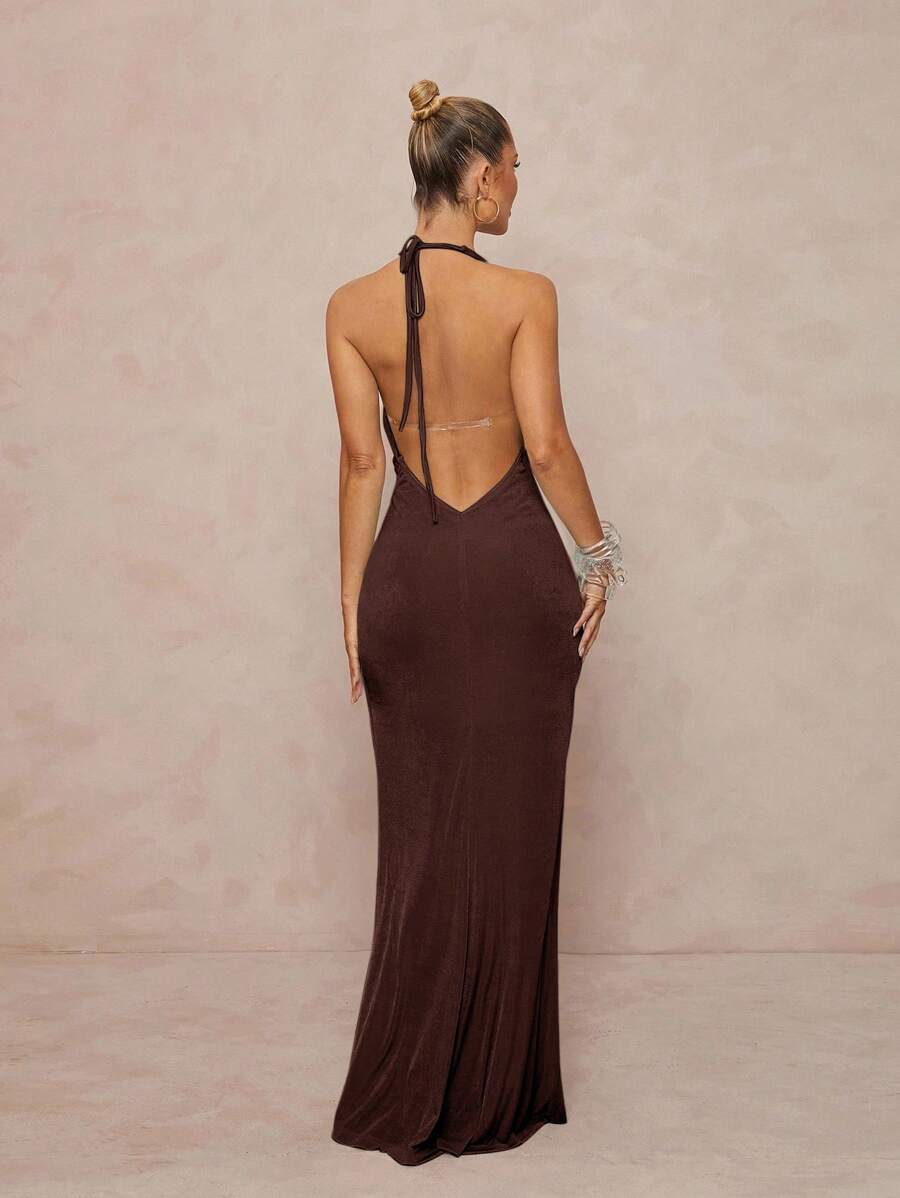 Turn heads wherever you go with this Elegant Metallic Halter Neck Dress. Its shimmering fabric catches the sun at beach vacations and glows under festival lights, making you the star of every party. Perfectly designed to flatter, this dress doubles as chic wedding guest attire, combining comfort with irresistible style. Dance, dine, and dazzle in a look that’s as fun as your plans!