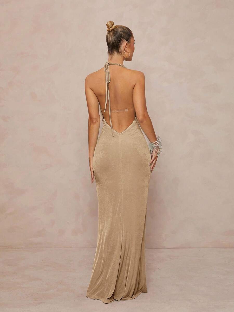 Turn heads with this Chic Metallic Halter Neck Dress, featuring a dazzling deep V neckline perfect for sun-soaked beaches or lively festivals. Its shimmering metallic fabric catches every ray and dance move, blending bold style with carefree fun. Lightweight and eye-catching, this dress is your go-to for days and nights that sparkle with adventure.
