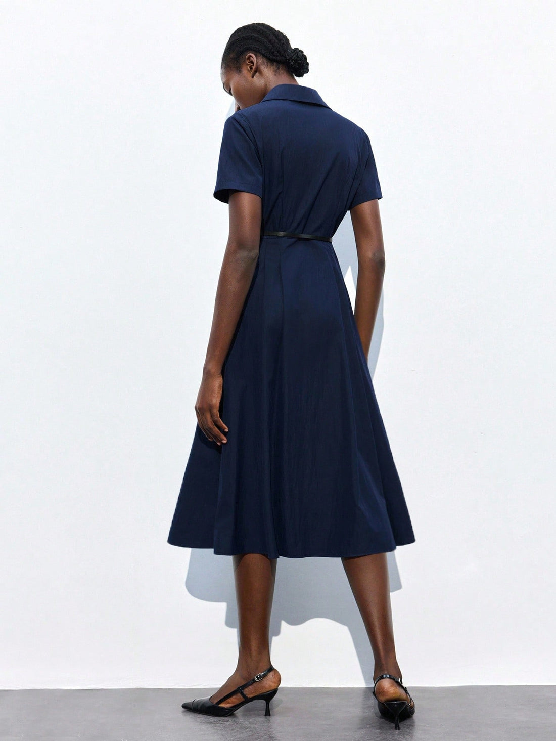 Step into style and confidence with this elegant navy blue collared dress, perfect for both business meetings and lively parties. Its short sleeves keep you cool while the tailored fit highlights your silhouette beautifully. Whether closing deals or dancing the night away, this dress adds charm and sophistication to any occasion.
