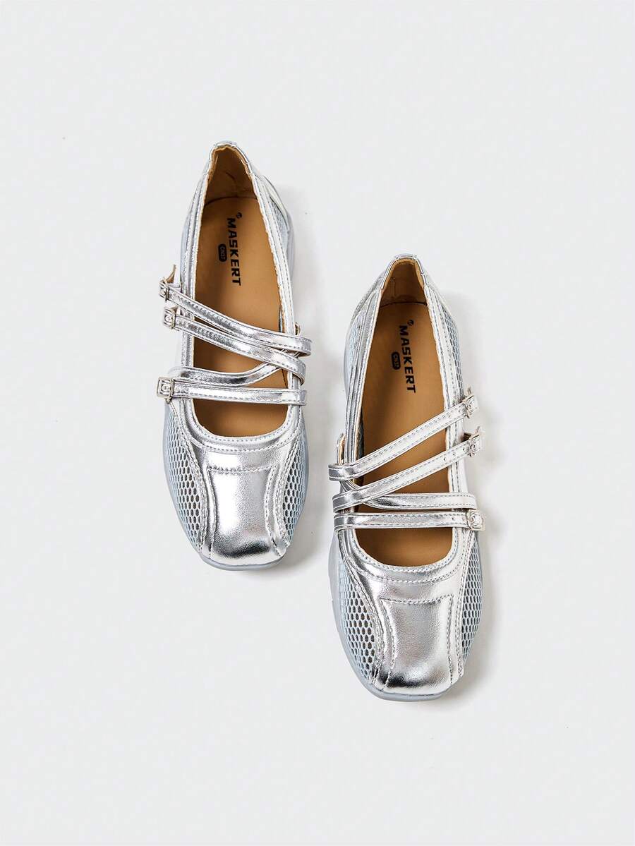 Overhead view of silver rounded-square toe Mary Jane flats with three buckle straps