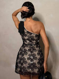 one shoulder floral sequin A-line mini dress in black nude contrast with asymmetrical neckline, floral embellished lace mesh overlay, scalloped hem and fitted bodice image 2