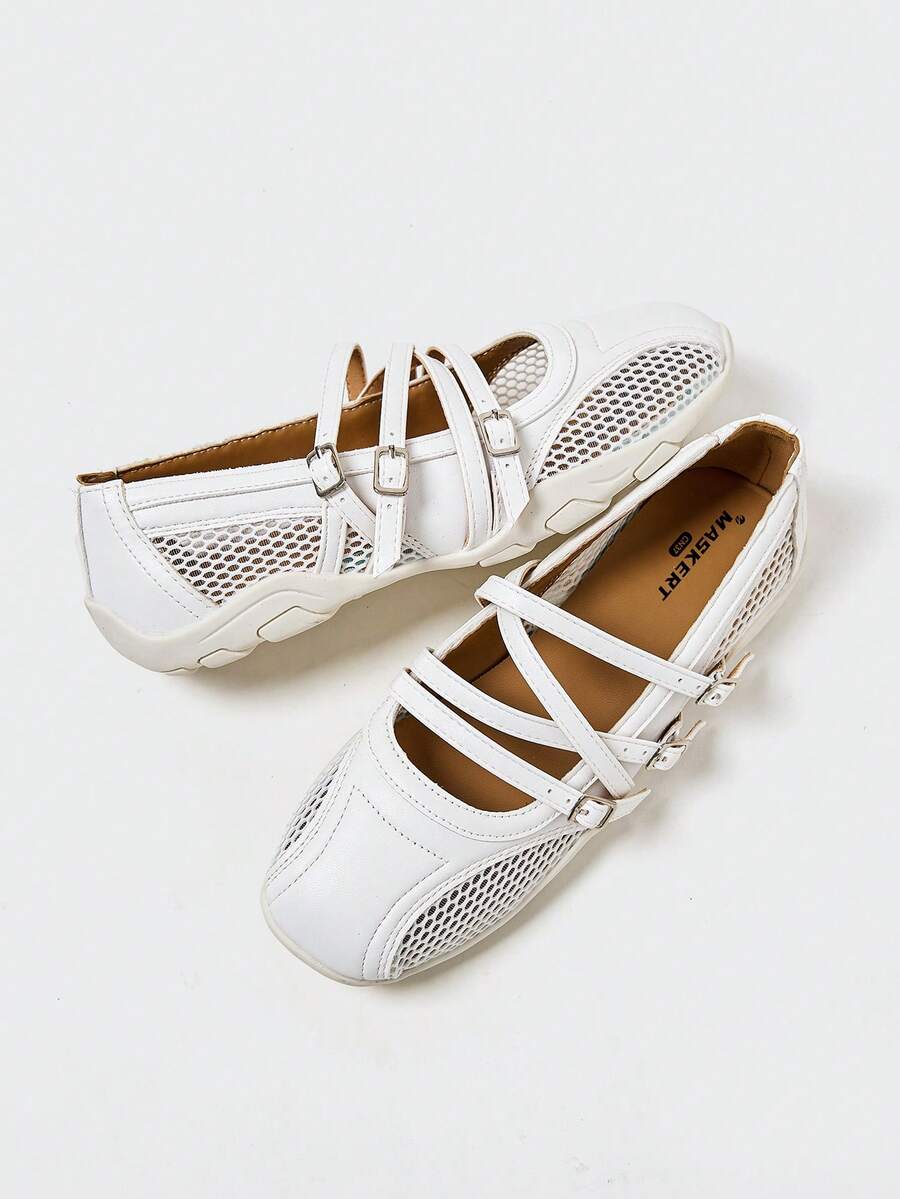 Angled overhead view of white three-strap mesh Mary Jane flats with segmented sole