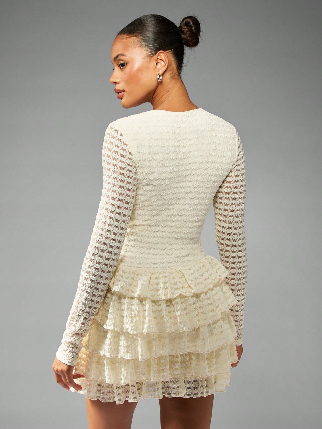 Get ready to turn heads in our Chic Ruffled Tier Mini Dress! With delicate crochet lace and elegant pearl buttons, this dress is the perfect choice for any winter party or wedding. The ruffled tiers add a touch of playfulness to this sophisticated piece. Be the life of the party in this one-of-a-kind dress!