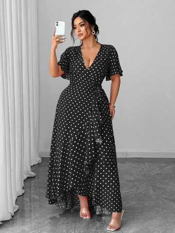 Front view of black polka-dot wrap maxi dress with ruffle hem