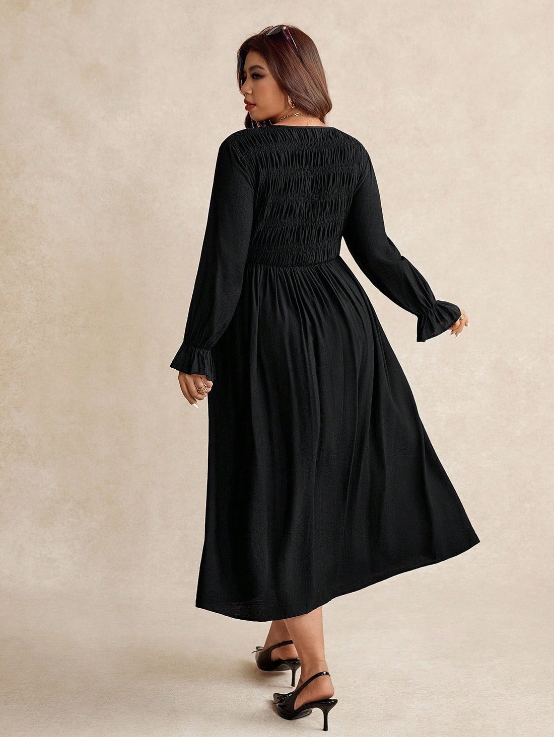 Slip into effortless sophistication with this stunning plus-size dress that celebrates your curves in all the right ways. The rich solid color and flowing long sleeves create a timeless silhouette, while the pleated detail adds a playful twist that keeps things interesting. Perfect for everything from brunch dates to evening events, this dress proves that elegance has no size limit. Comfort meets style in a piece designed to make you feel absolutely fabulous.
