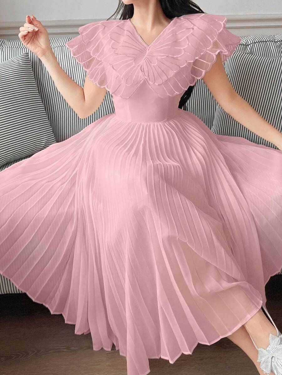 This playful mid-length dress features delicate butterfly embroidery that adds a whimsical touch to its soft pink fabric. The charming pleats create a graceful flow, making it perfect for twirling through sunny afternoons or special occasions. Embrace effortless elegance with a fun, flirty style that stands out wherever you go.