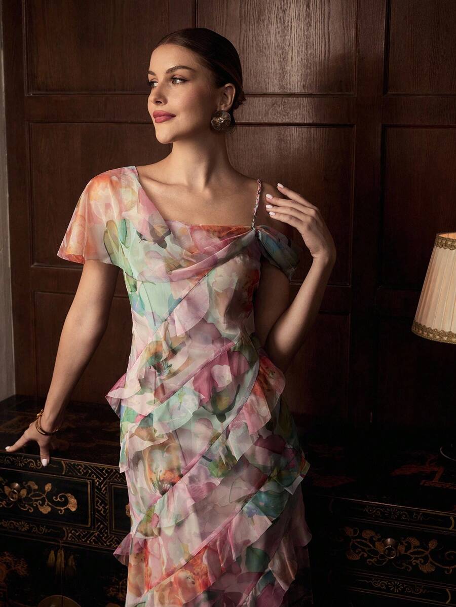 Step out in style with this Elegant Floral Print Dress, designed to turn heads with its asymmetrical shoulder and playful ruffle hem. The floral pattern adds a touch of charm, while the unique cut highlights your silhouette beautifully. Perfect for sunny days or evening outings, this dress combines comfort and flair for a delightful, feminine look.