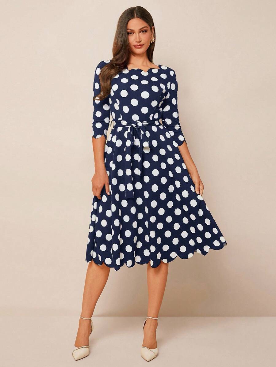 Step out in style with this playful black and white polka dot midi dress, featuring a charming shell trim that adds a touch of whimsy. Perfectly versatile, it transitions effortlessly from casual days to lively parties and even polished business settings. Flatter your figure with a fun, feminine silhouette that never goes out of style.