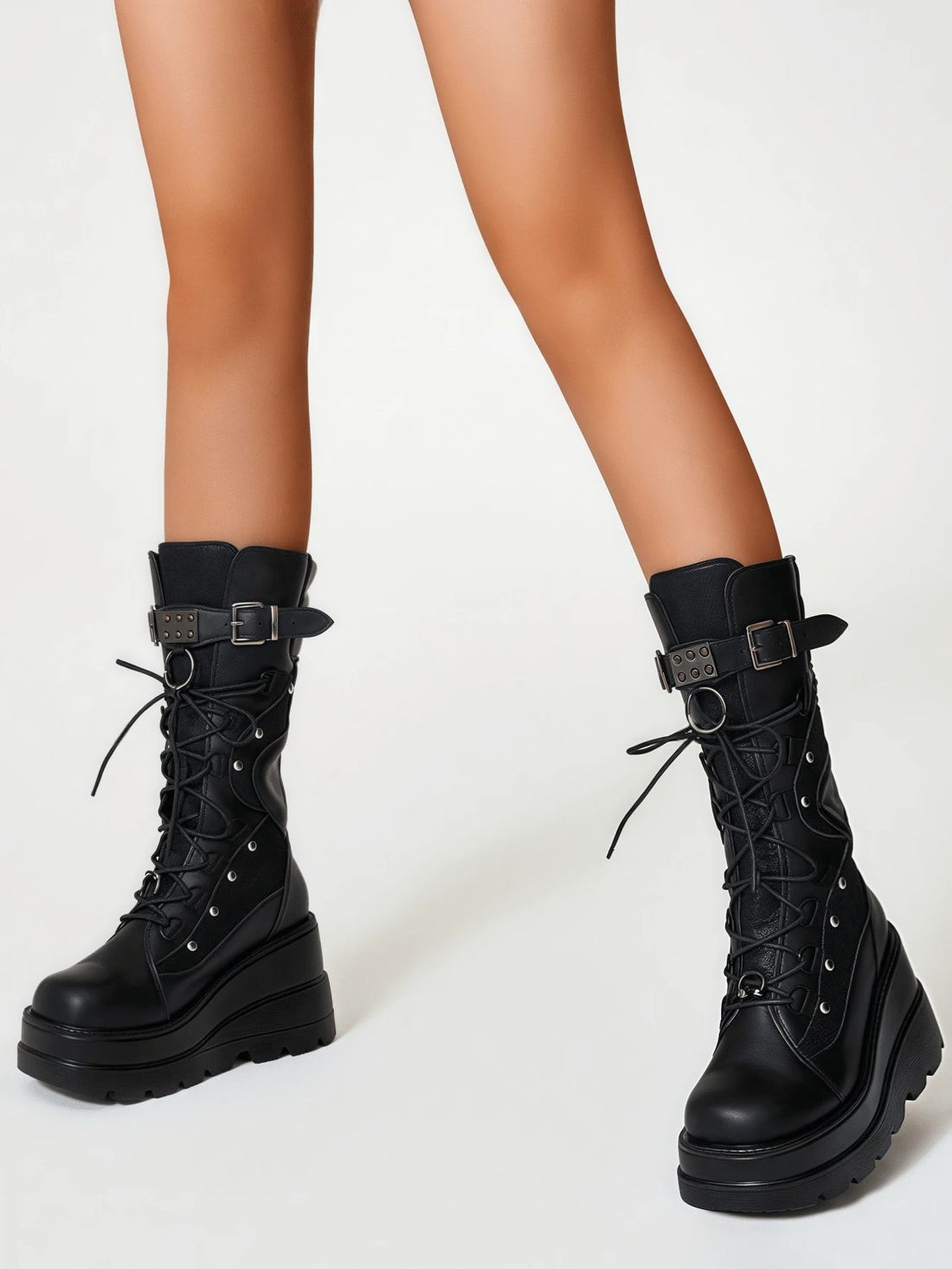 Own the night in these fierce lace-up platform boots that scream rebellion. Studded with gleaming rivets and built for attitude, they're the ultimate statement piece for anyone who refuses to blend in. Whether you're hitting the club, cruising on two wheels, or just living your darkest fantasy, these boots deliver serious edge with every stomp. Comfortable enough to wear all night, bold enough to turn heads—because conformity is so last season.