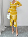 Front full view of mustard striped rib-knit long-sleeve dress with front slit and scalloped white-trim hem