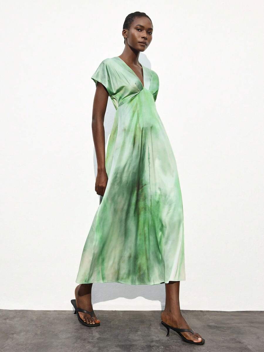 Embrace effortless style with this Boho Chic Multi-Color Tie-Dye Asymmetric Dress. Its playful tie-dye pattern and unique asymmetric cut make it perfect for beach days, festival fun, or dancing at weddings. Light and breezy, it moves with you, keeping your look fresh and vibrant wherever you go.